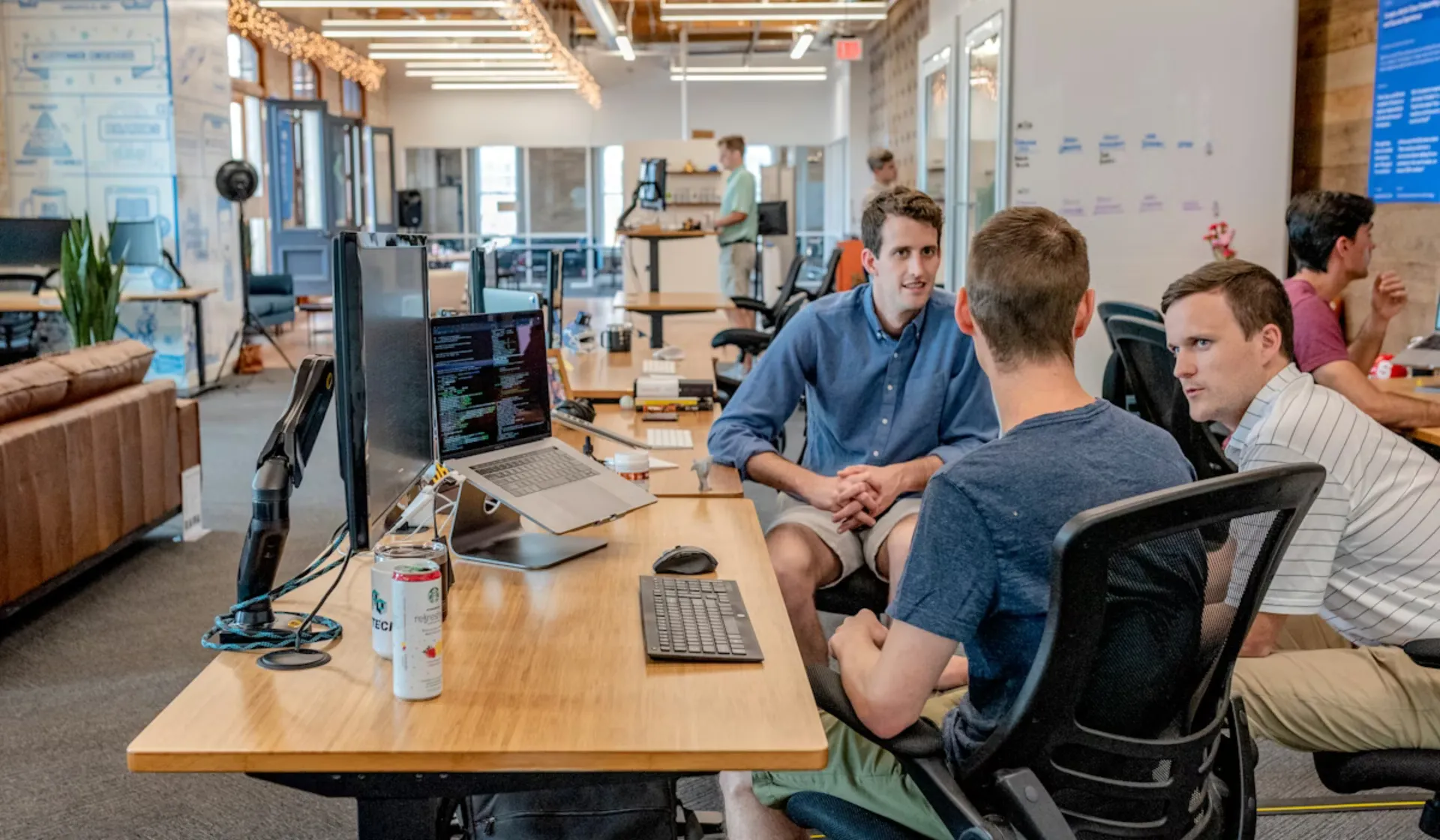 Contractor business team reviewing internet marketing strategy and lead generation dashboard — digital marketing for remodeling and trade businesses